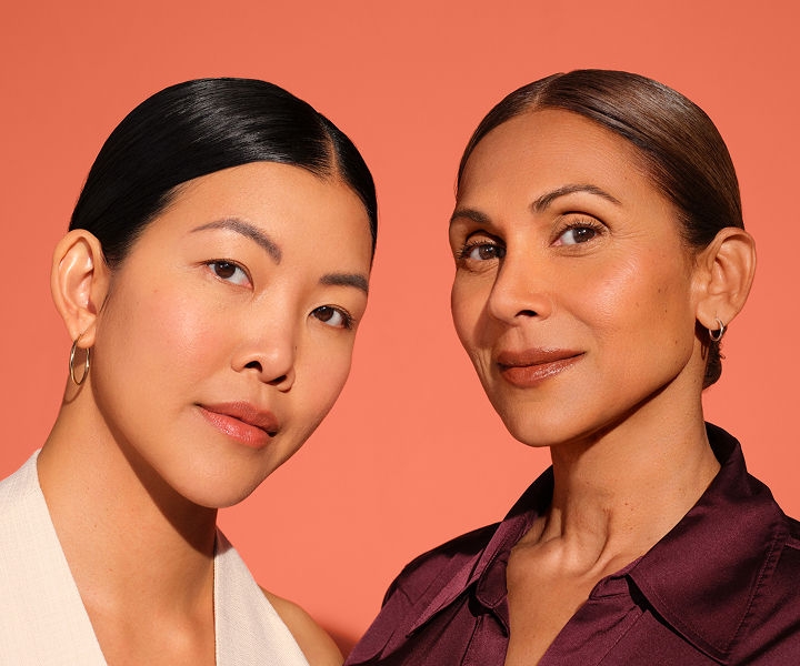 Picture of two women who were treated with Juvéderm smiling with naturally looking lips